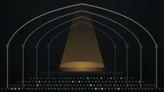 Inside a hall of tall pointed iron arches with a glass roof, a single spotlight falls on an empty stage with no microphone stand, facing rows of small audience dots.